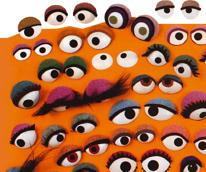 A collection of puppet eyes on a bright Orange background